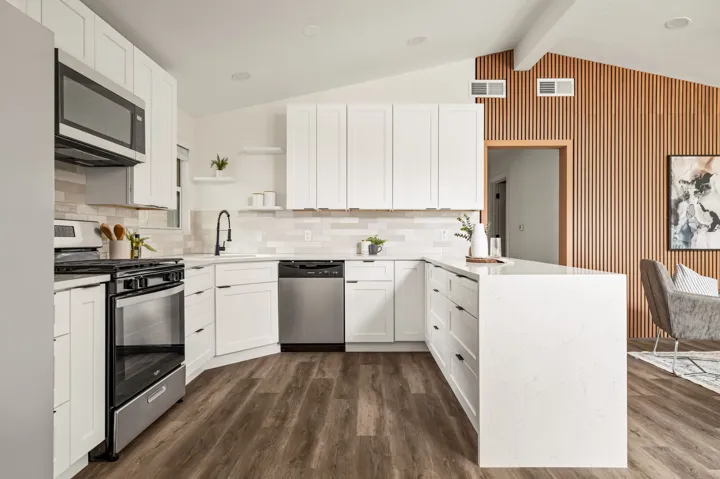 White shaker kitchen with stainless appliances