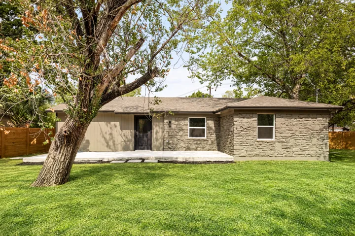 Large backyard with mature trees